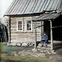 Rusija: Kabina za brvnara, 1910. Na Bashkir Čovek sjedi na koracima brvnara u planinskoj regiji Ural